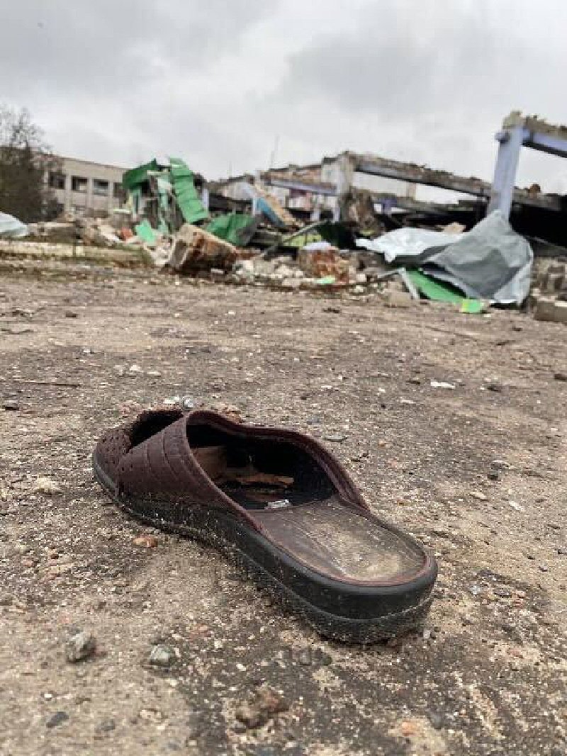  Where is the owner of this single shoe? Are they still somewhere in Kherson, trying to get by in a city that has been destroyed by the Russian invasion and occupation? Or did they leave to look for safety in western Ukraine or abroad?  