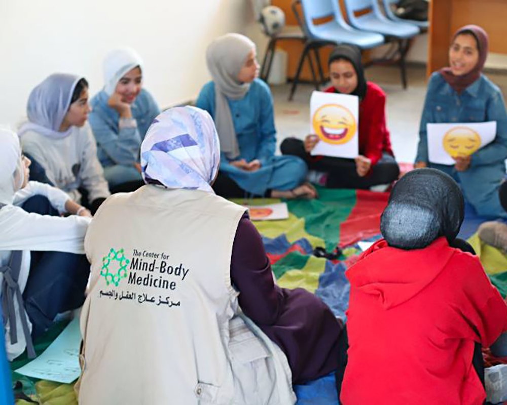  A CMBM team member hosting a psychological support session for youth in Gaza. 