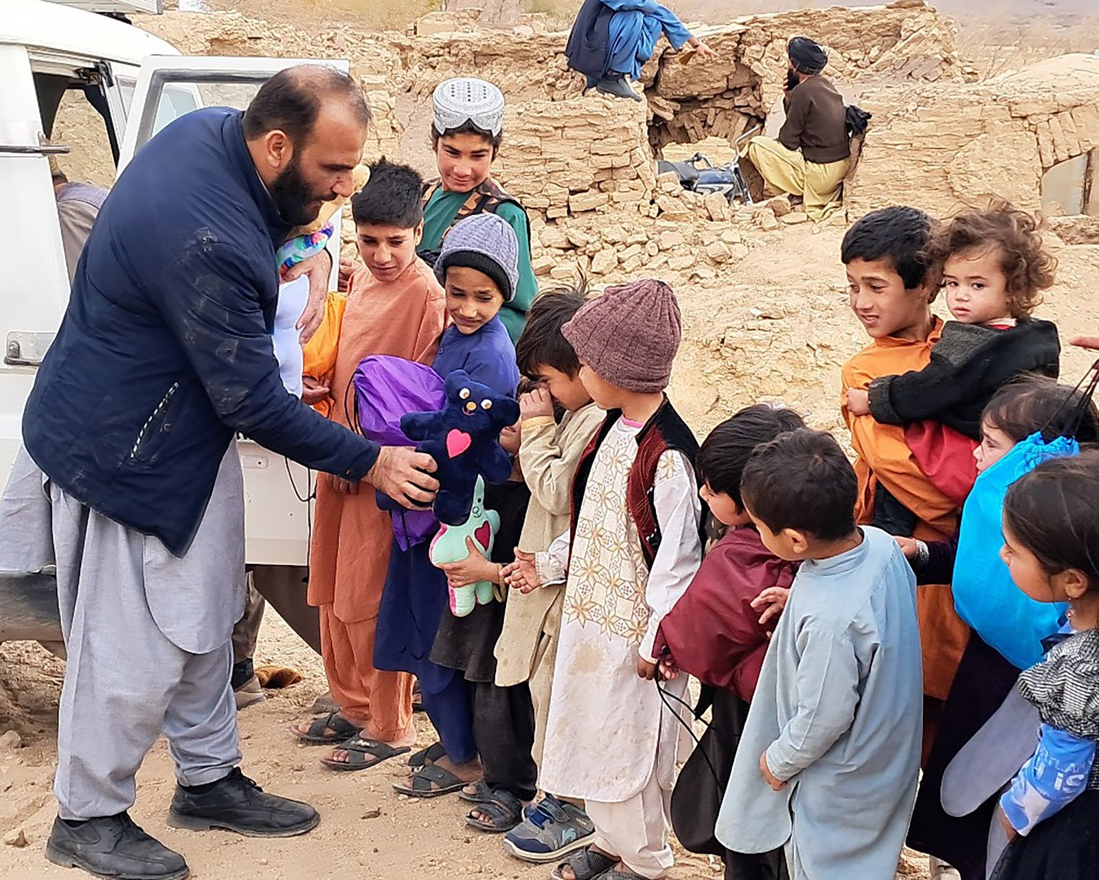  An LHI aid distribution for children in Afghanistan. We go the extra mile to include handmade stuffed animals, quilts, and “You Are Loved” cards. 