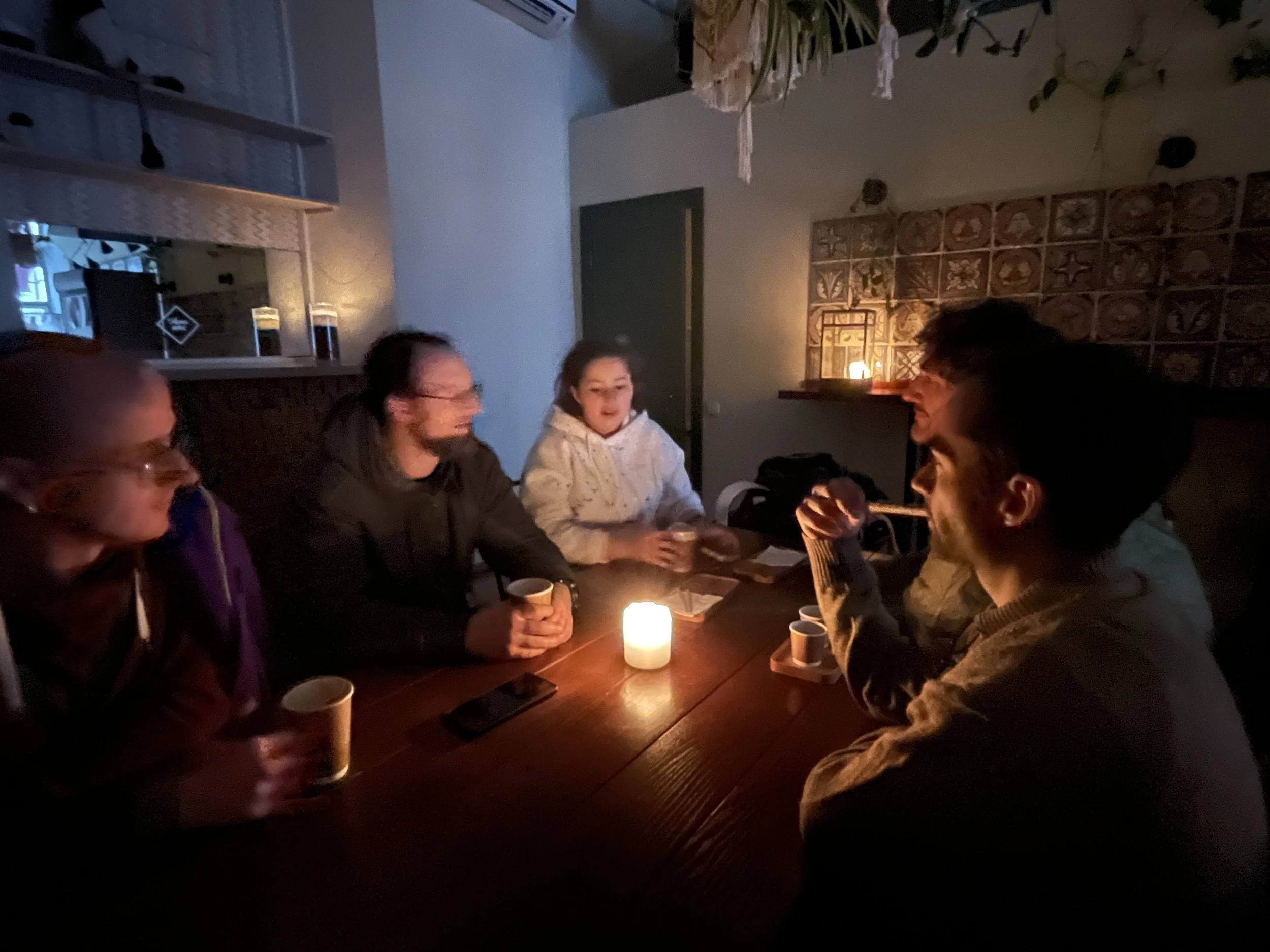  The LHI team holds a meeting by candlelight at a cafe in Odessa. 