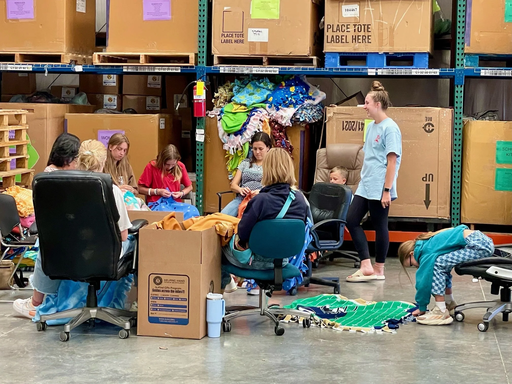 Volunteers tied fleece fabric into cozy blankets that will keep beneficiaries all over the world warm! 