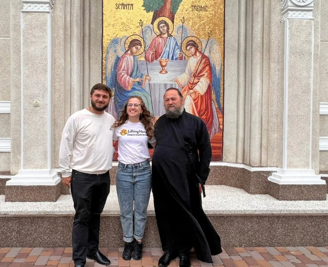   Hayley with Priest Vasiliy (left) and Father George (right) in Chernivtsi.  