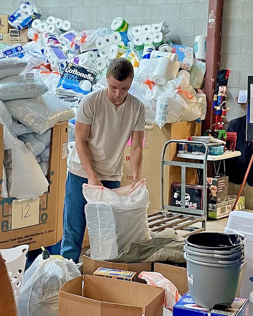  Nikita helps gather materials to set up an apartment for a refugee family resettling in Utah. 
