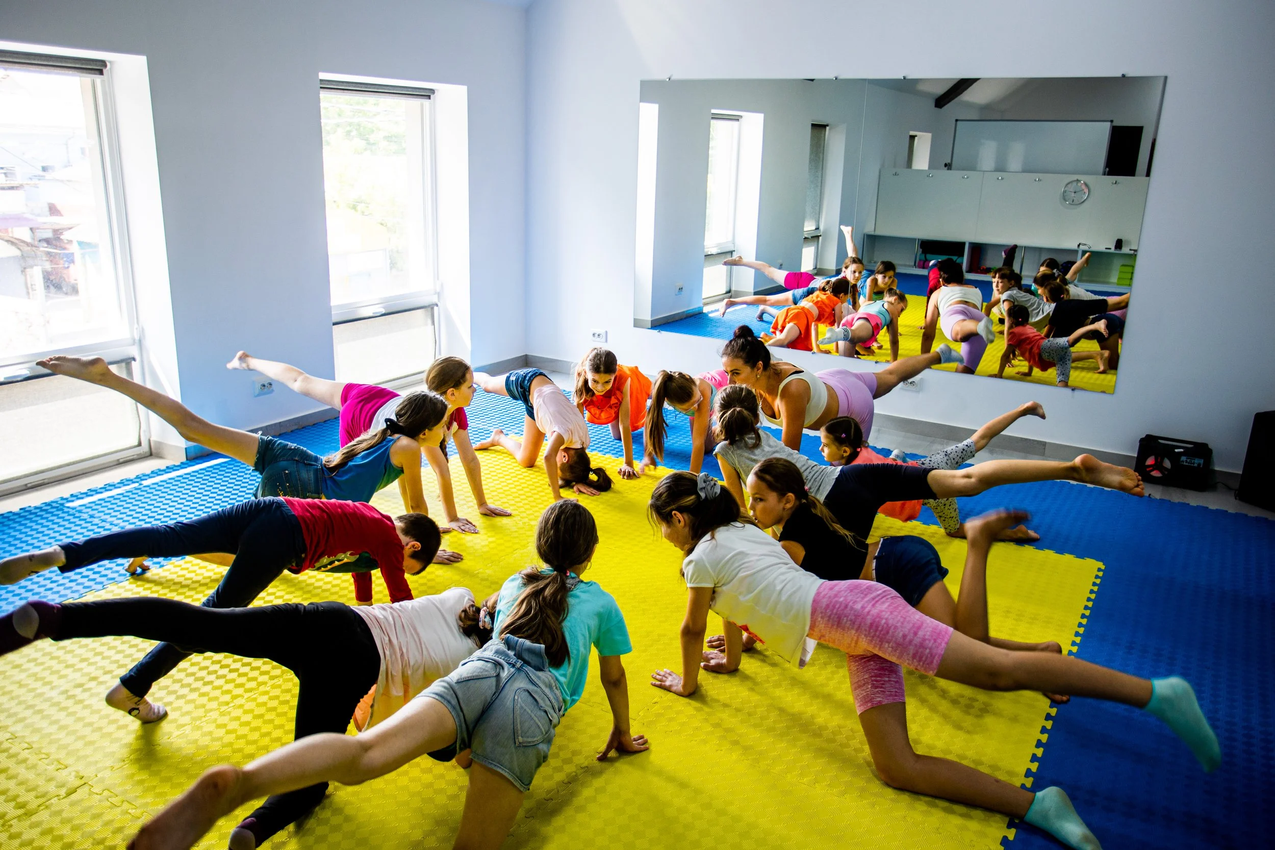  Children at the LHI Community Center in Balti participate in a yoga class, part of the social emotional supports offered to Ukrainian refugees. 