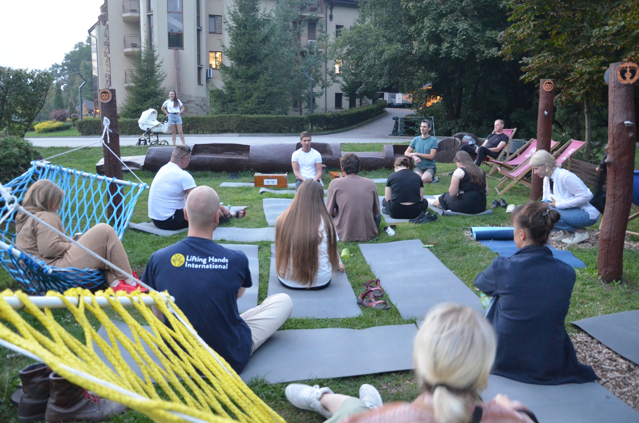  Conference participants, many of whom work on the front lines or with people who have evacuated from the front lines, take a moment for meditation and self-care. 