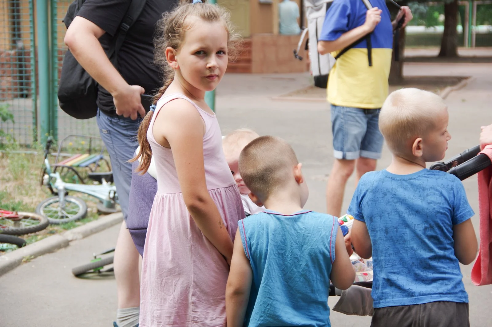  A young Ukrainian girl and her brothers examine the contents of their food box. 