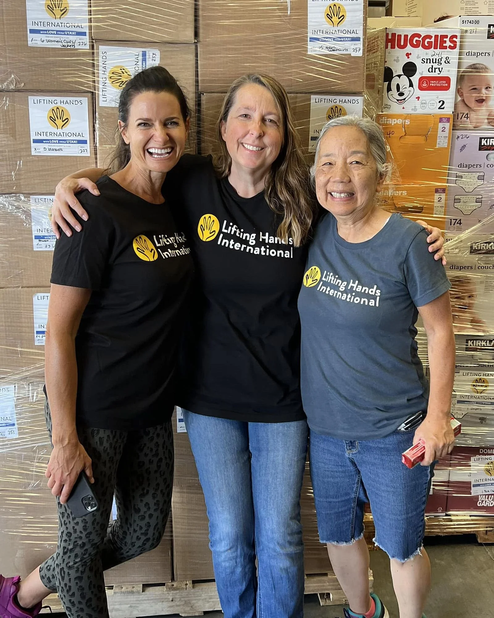  Author and LHI Utah Resettlement manager Anne with LHI Utah Director Traci, and Marvis, LHI Utah Foreign Aid manager are all thrilled to have more warehouse space! 