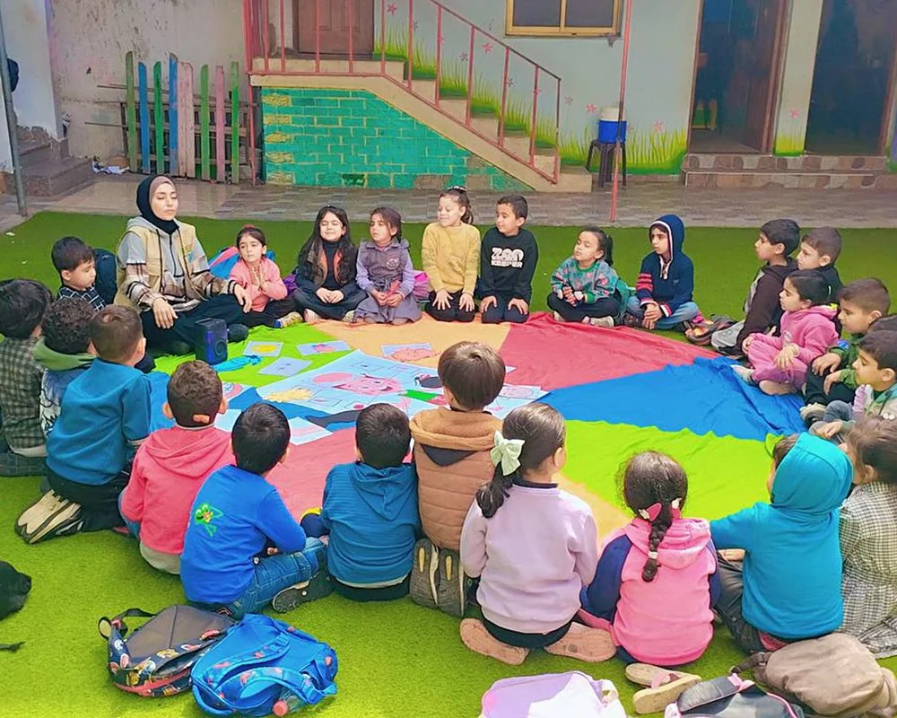  A CMBM team member leading breathing exercises with children. 