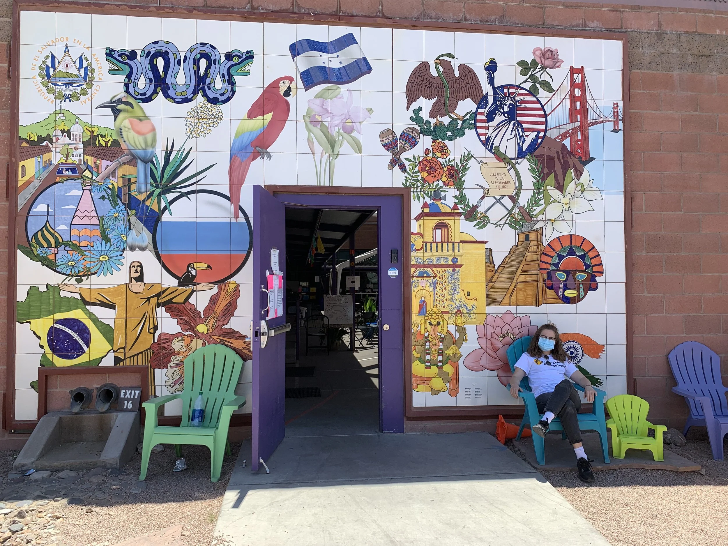  LHI’s founder and director Hayley Smith and COO Walker Frahm visited shelters along the border that receive and distribute aid from LHI. Here, Hayley poses with artwork outside a shelter in Tucson, AZ. 