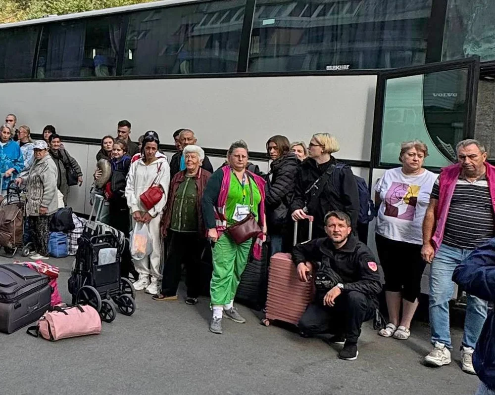  Evacuees waiting to board the bus out of Zaporizhzhia. 