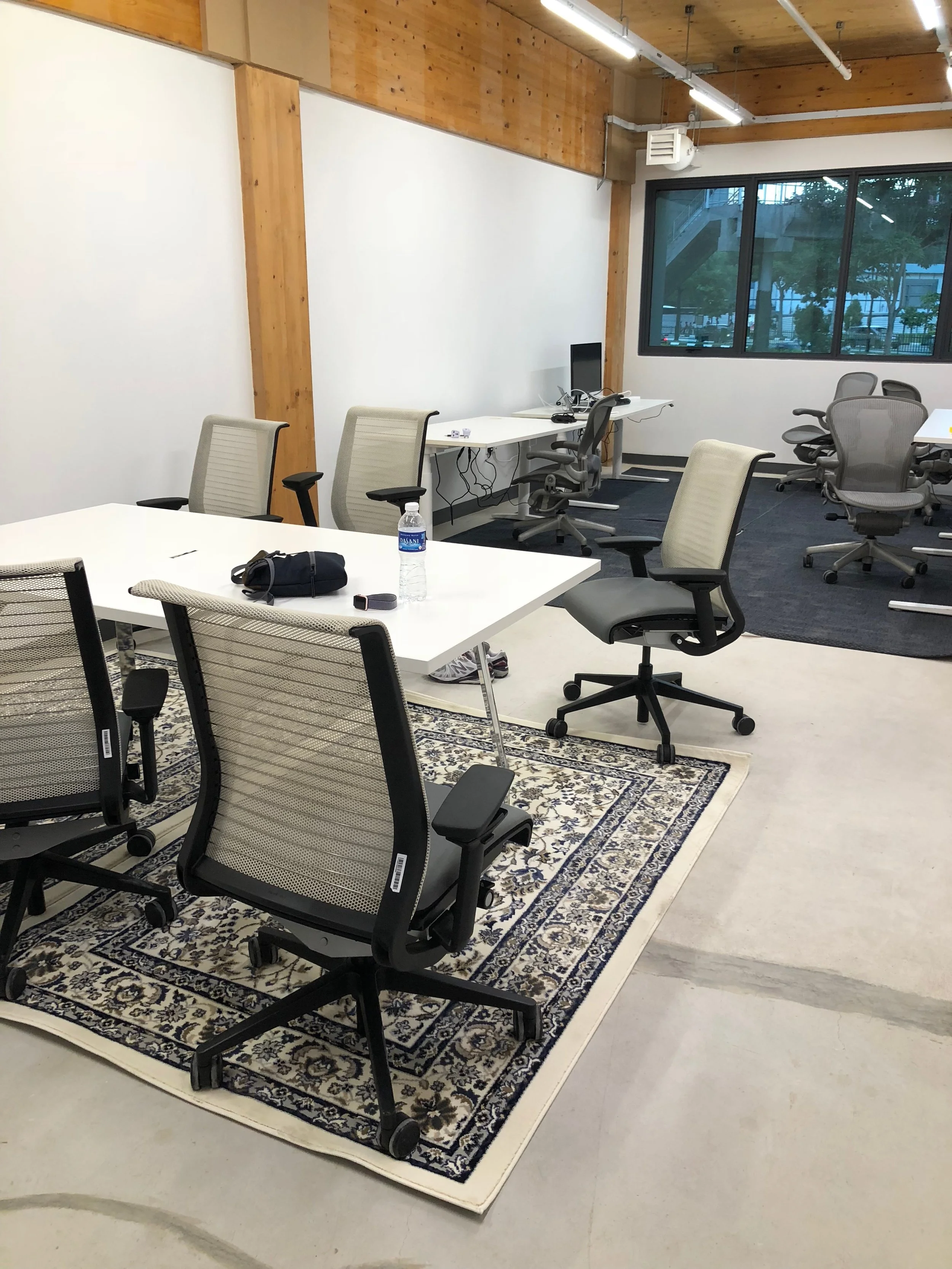 with rugs by conf table and desks 1.jpg