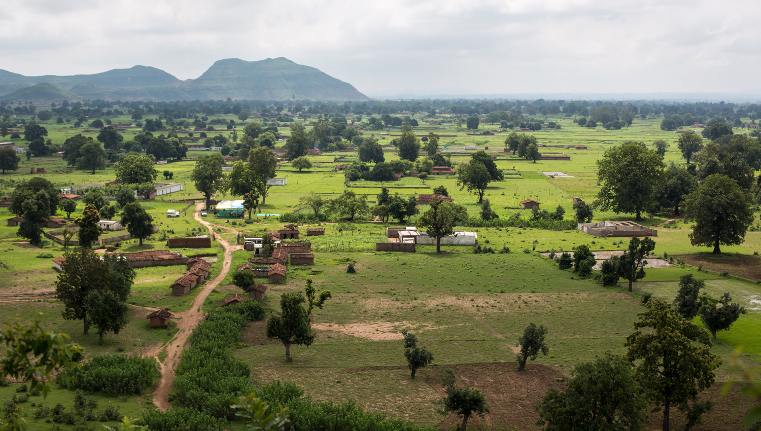 The beautiful village of Amelia in the Mahan forests of Madhya Pradesh, INDIA. The hills in the background are the overburden of a neighbouring thermal power plant.