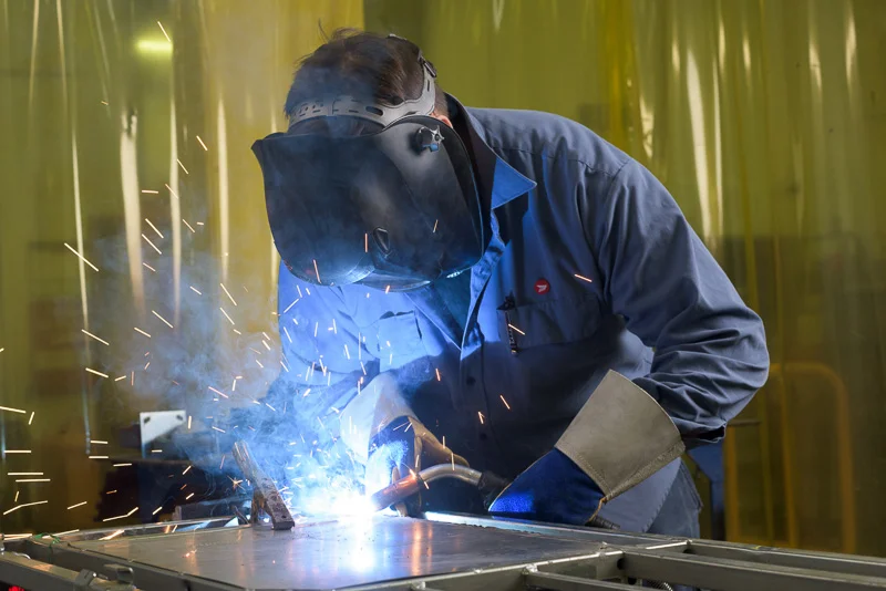 A mechanic welds a cart in the machine shop of a Canada Post facility. Getting these welding shots is tricky because you can’t really look through the view finder without damaging your eyes. There is quite a bit of guess work with these types of industrial photographs.