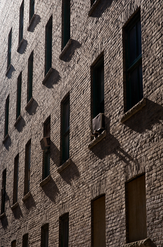 The side of an early 20th century building © Robert Lowdon Bricks contain a lot of texture and capture so eloquently. In this image the sun is graciously giving some side lighting to this building, showing all of its beautiful textures.