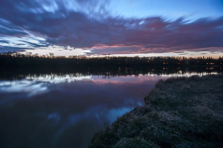 After Dark on the Red River. Long Exposure photograph overlooking the Red River, Winnipeg MB, Canada