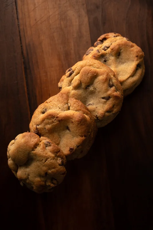 A row of cookies on the table. © Robert Lowdon