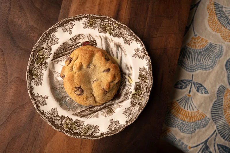 A single cookie on a plate. © Robert Lowdon
