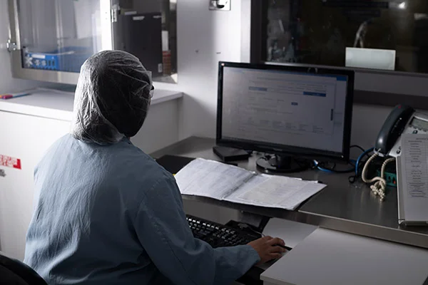 A researcher at a computer