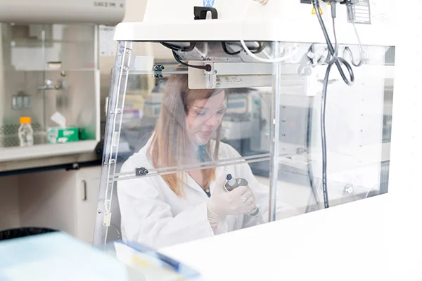 A lab technician working in the lab.