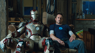 Robert Downey Jr. (right) with his suit in Iron Man 3. (The_JIFF / Flickr)