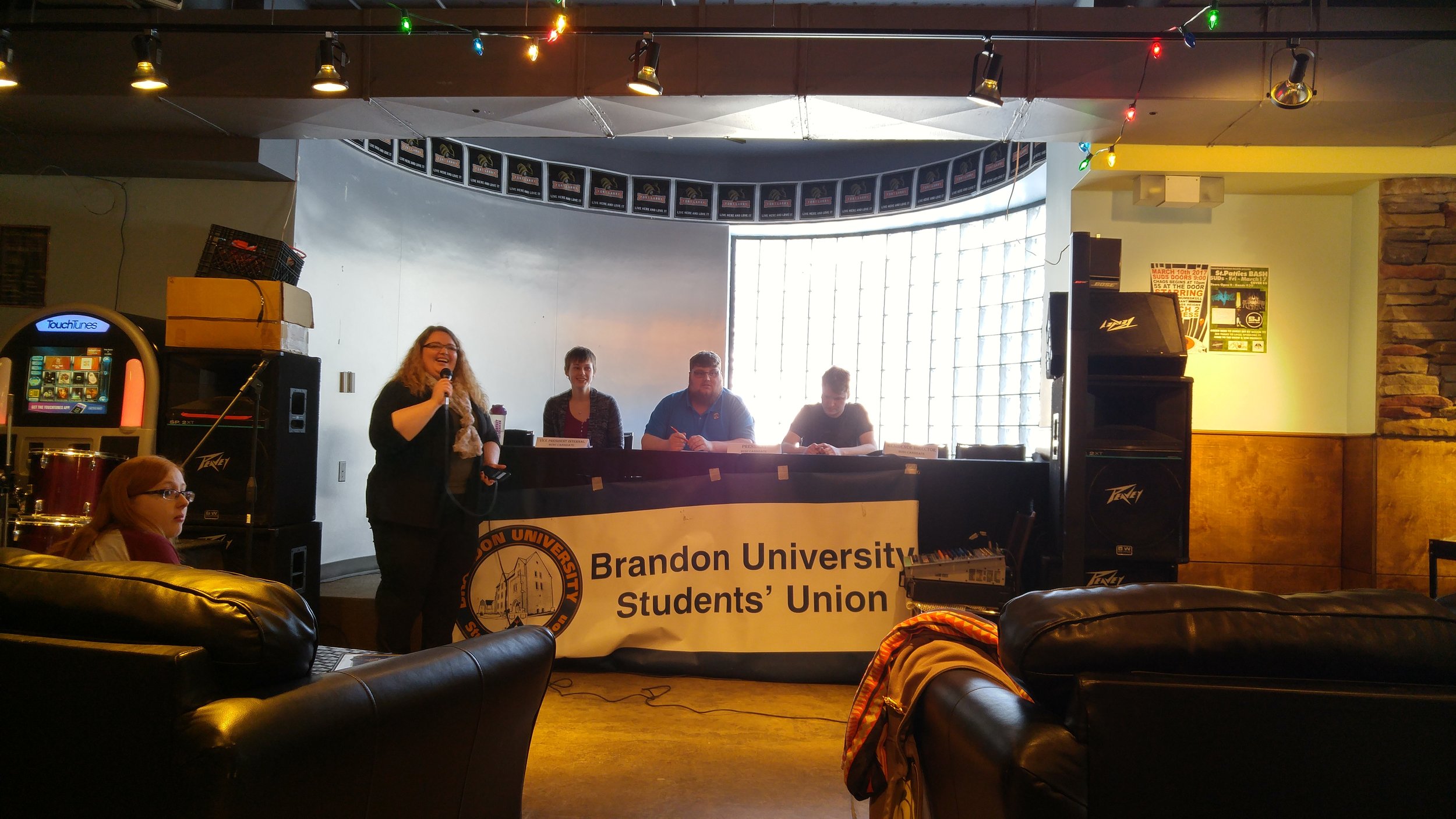 Vice-President Internal candidate Emily Simon, and presidential candidates Dylan Hoppe and Nick Brown, with RO Krystal Kayne. (Credit: Logan Praznik/The Quill)