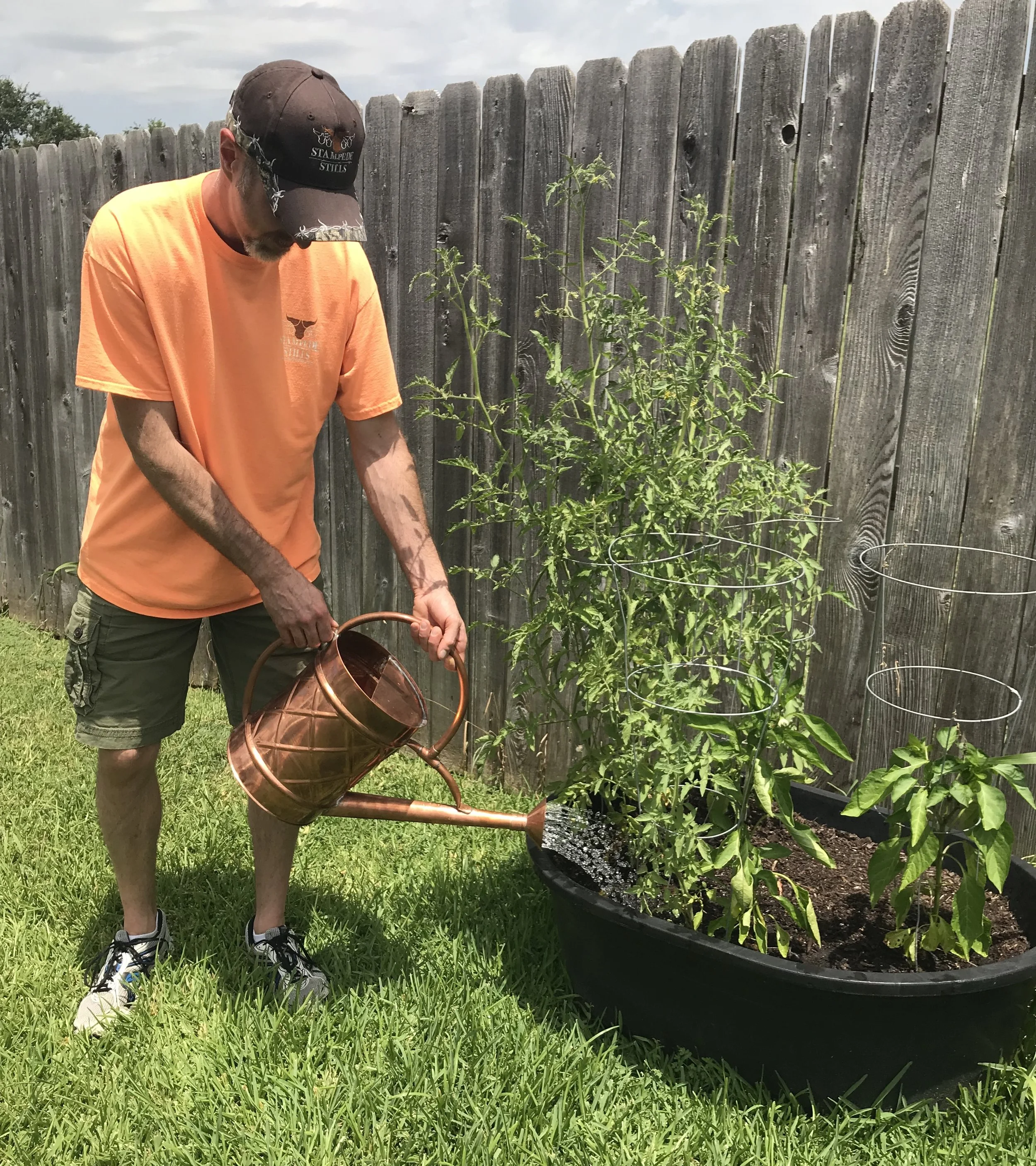 Todd Gillespie of Stampede Stills using a custom-built watering can.
