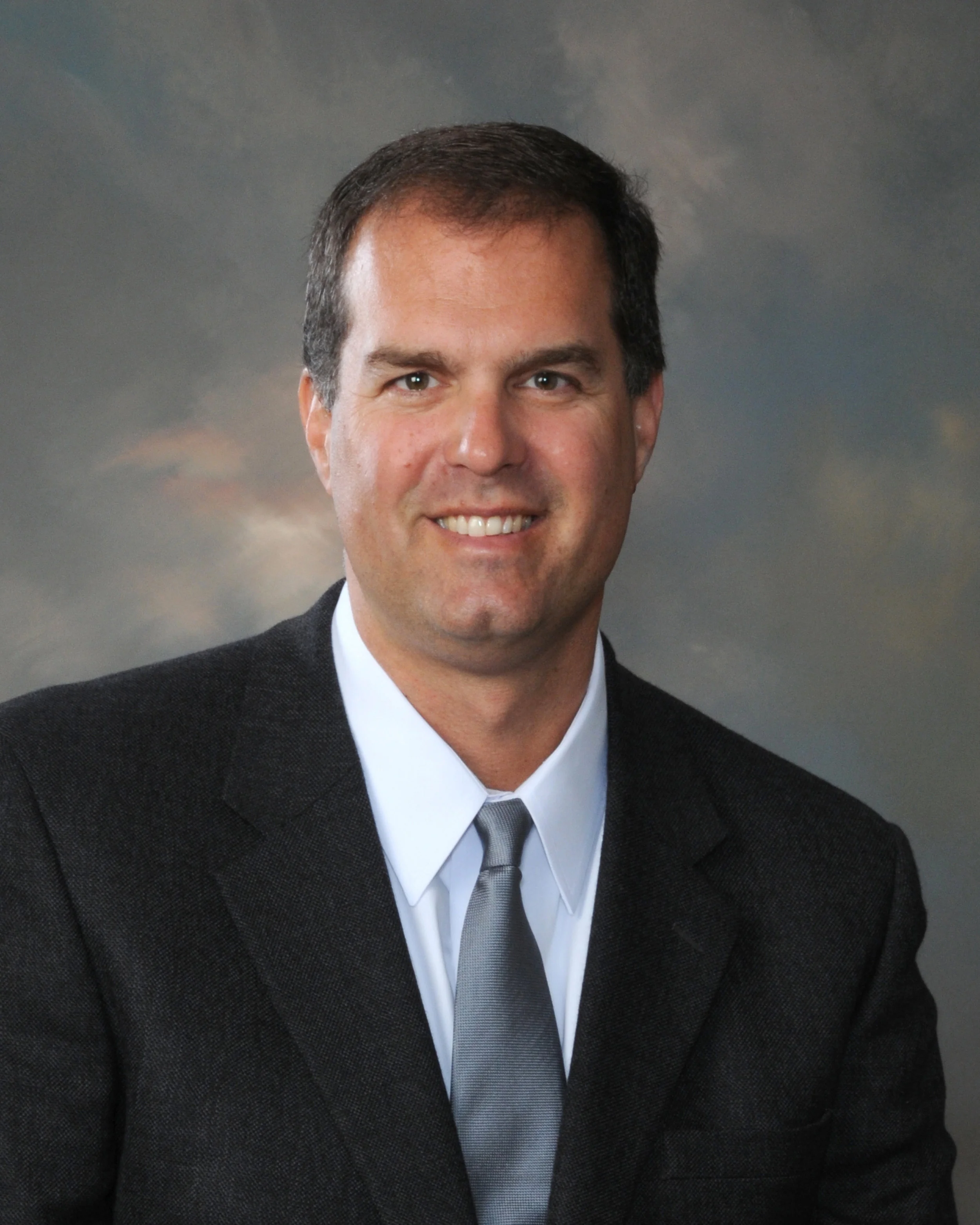 dr mumber no beard suit head shot.jpg