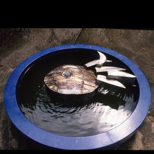 Private fountain Stainless steel fountain element with porcelain enamel rim.