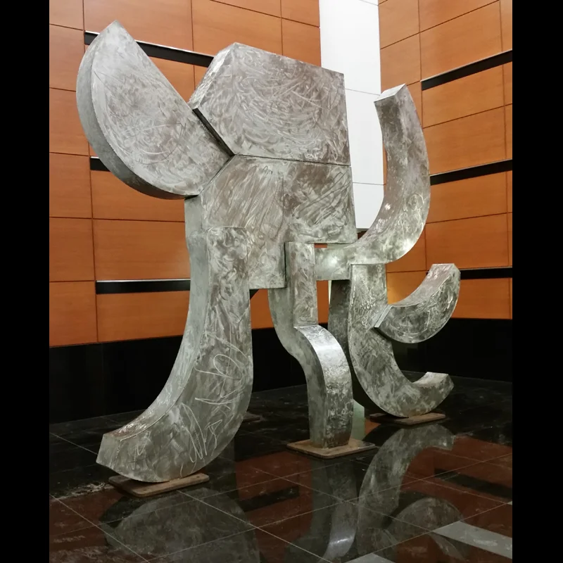 Looking good. Note the reflection of the sculpture in the highly-polished stone floor.