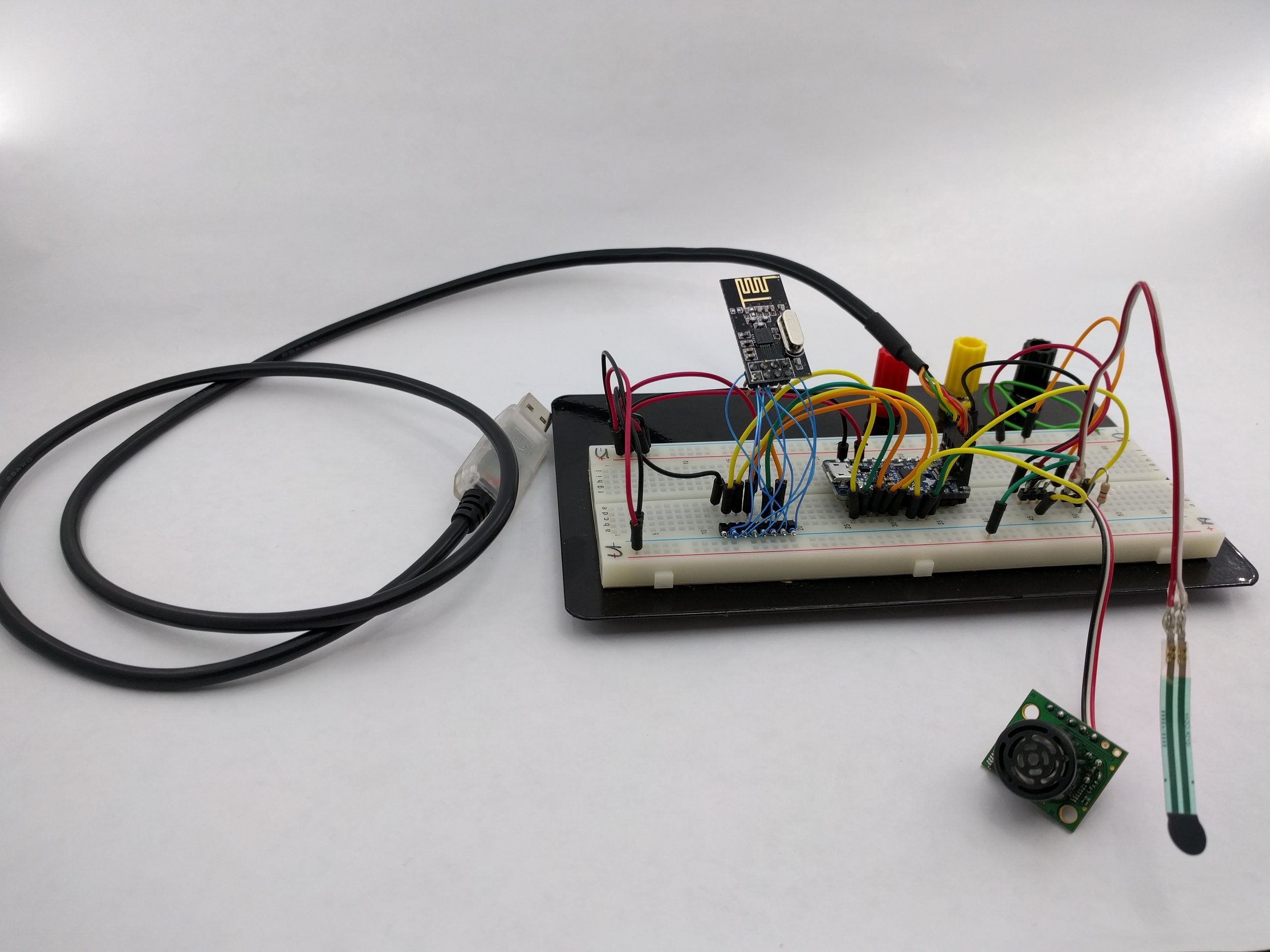 Transmitter prototype with Adafruit Pro Trinket 3V, nRF24L01+, with Sonar and FSR sensors.
