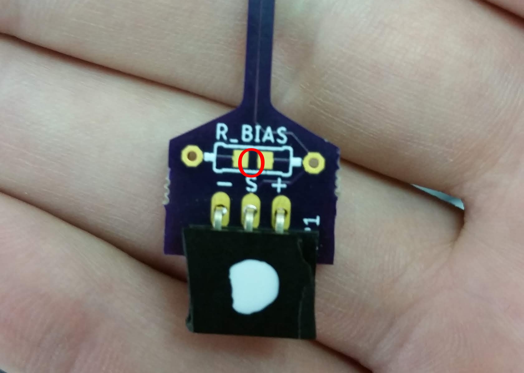Image of the base of the  heater  resistor. Notice the 90 deg female headers, the dip of fingernail polish identifying it, and the lack of a bias resistor.  Probes with the thermistor will have a bias resistor .&nbsp;The bias resistor has optional pads to replace the through-hole mount with another 0603 resistors cirlced in red-- for the heater probes these should be "shorted" using a large glob of solder.