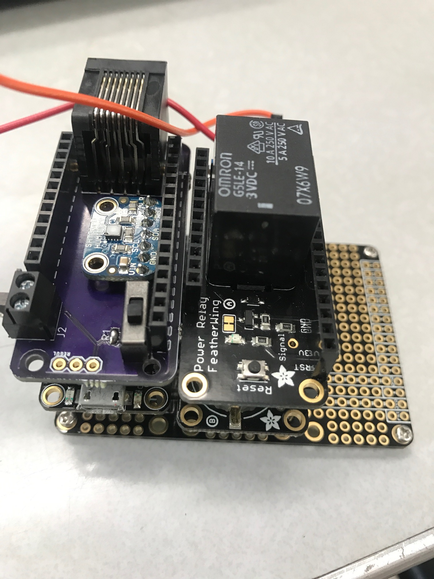 Stack the Power Relay on top of the Adalogger and place the new block onto the FeatherWing Tripler.&nbsp;