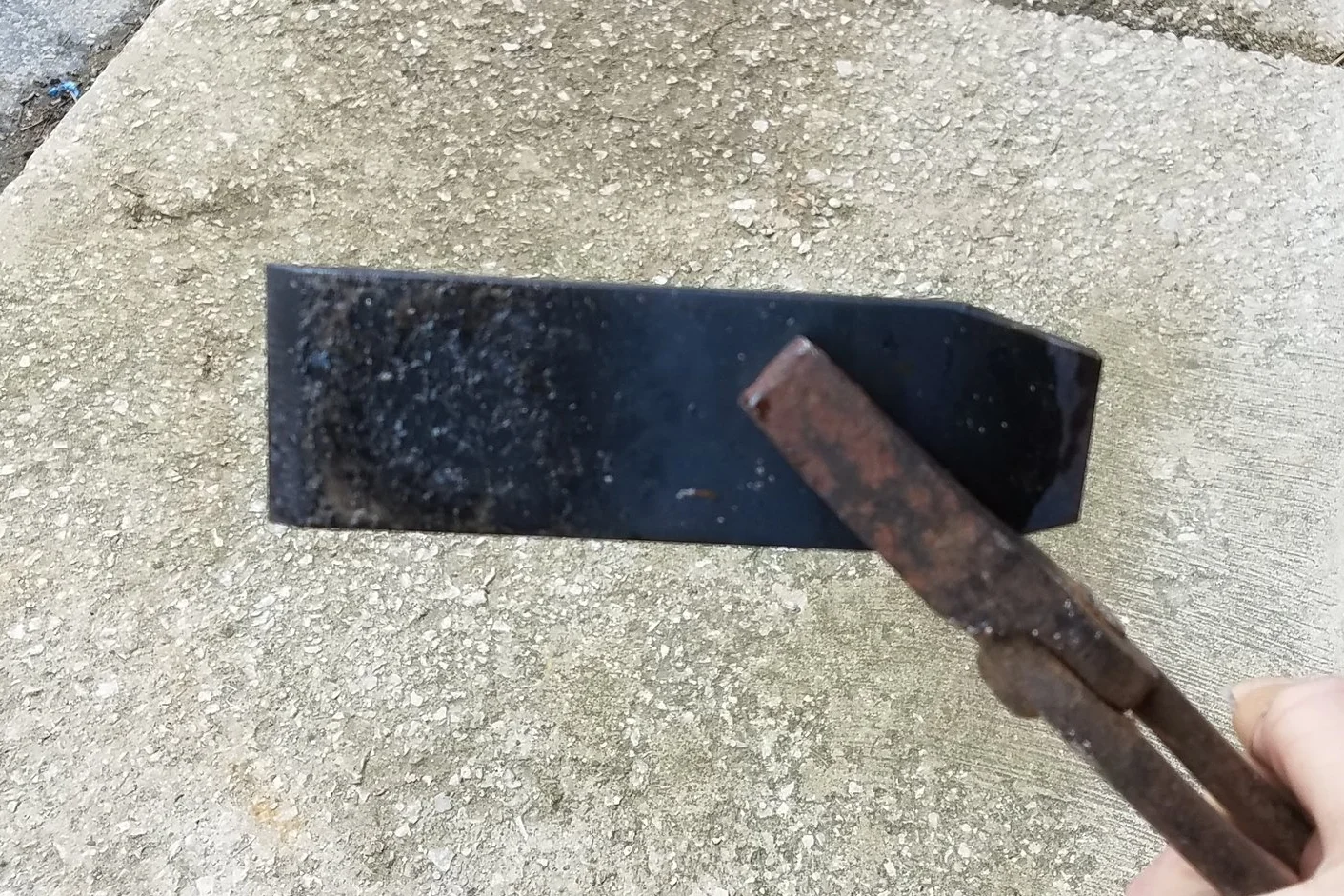 My iron right after the quench. Note the flaky scale. 