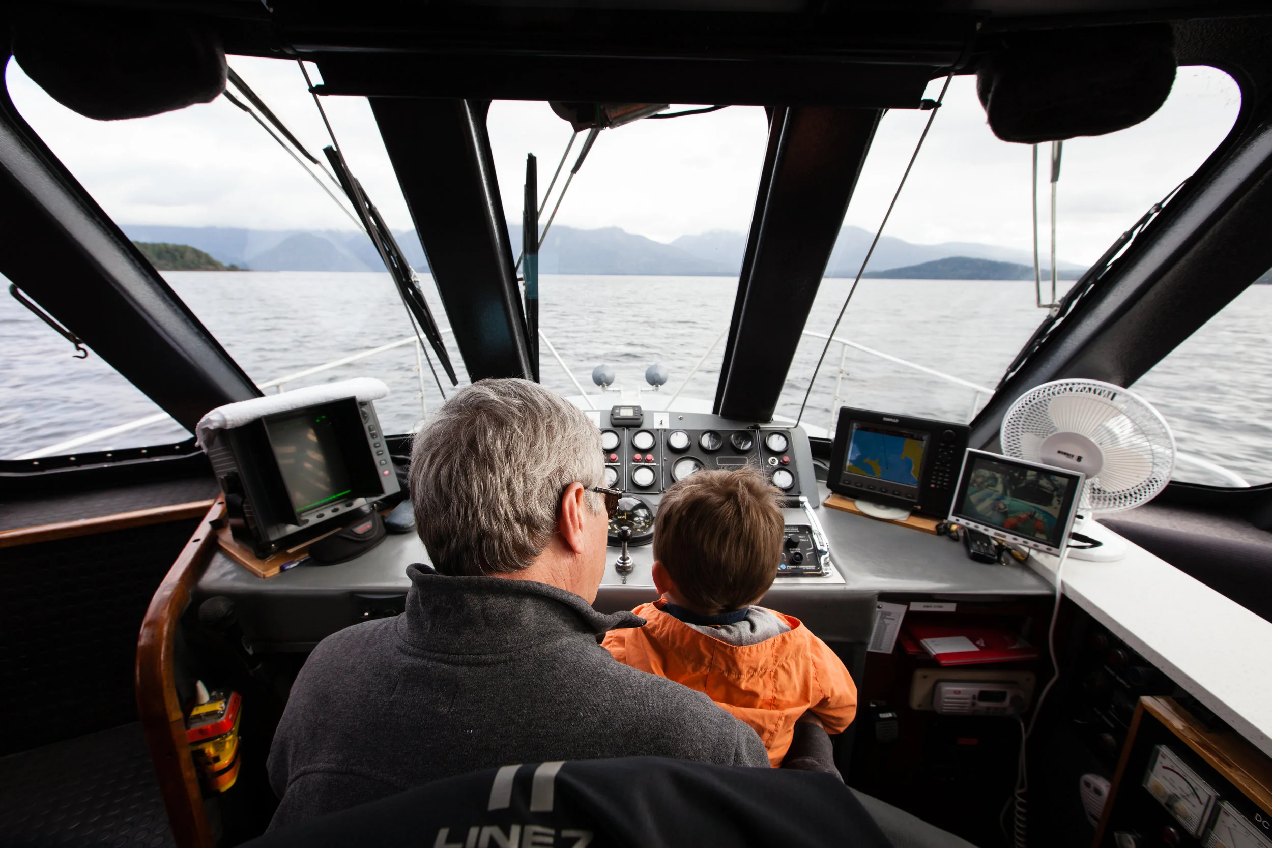 Sitting with Grandpa in the Captain's seat. 