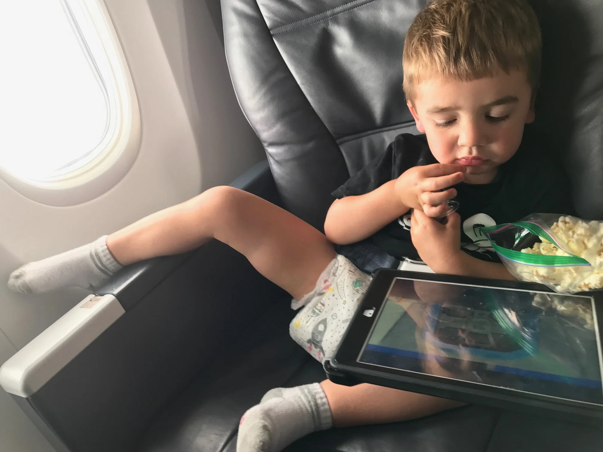 This kid wouldn't wear pants... even in first class... oh well, not worth the fight! iPhone photo