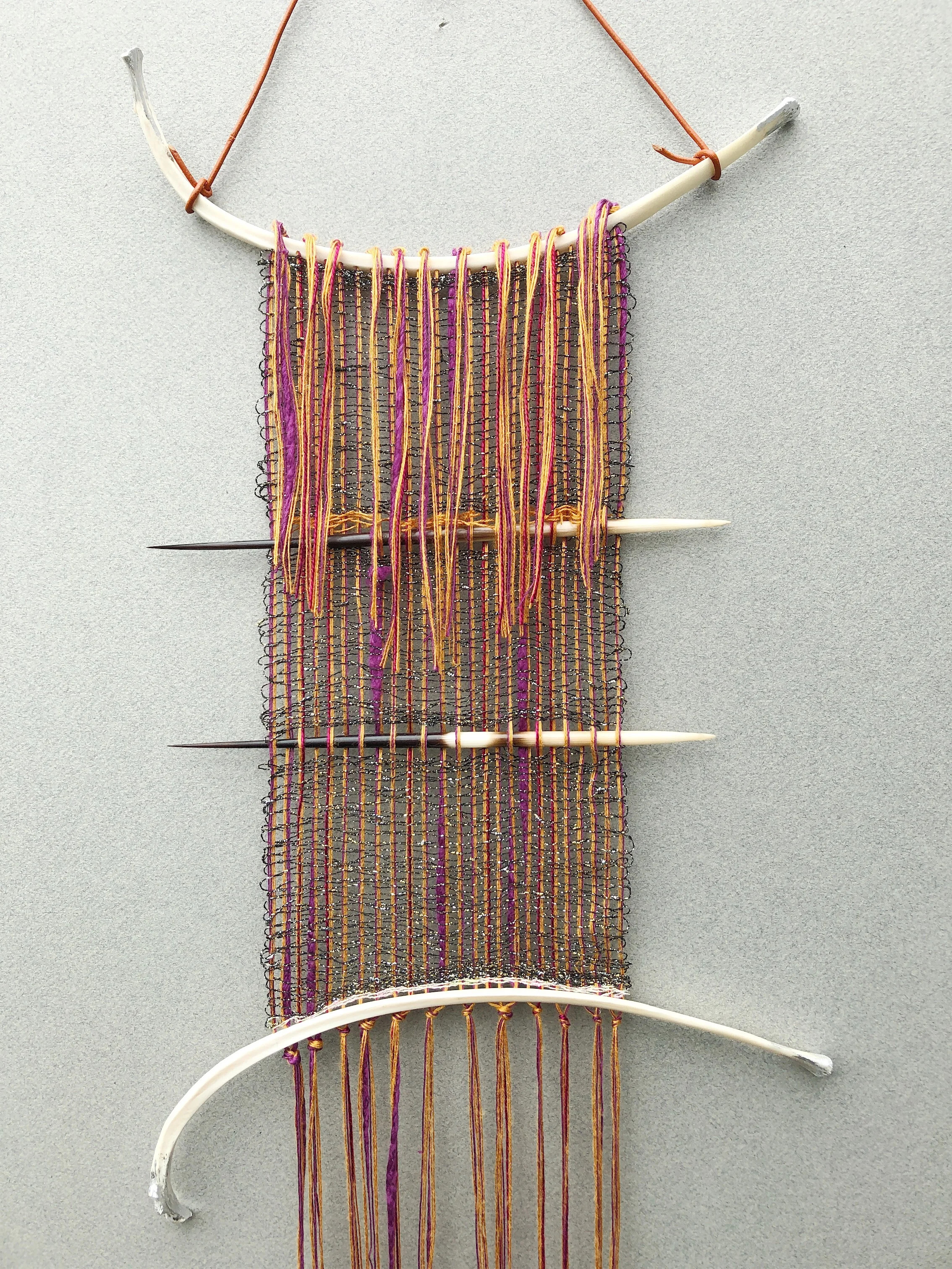 Weaving with bone, quills.