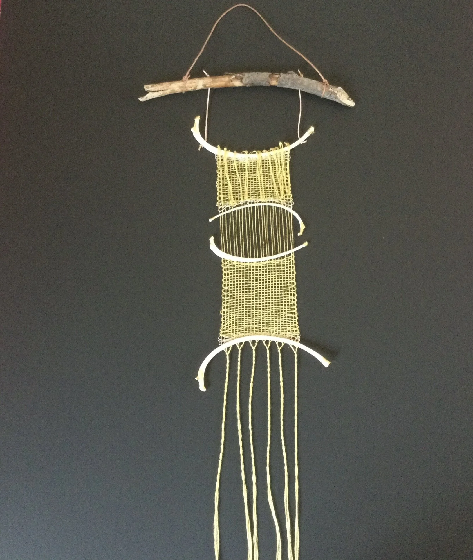 Weaving with driftwood and bone