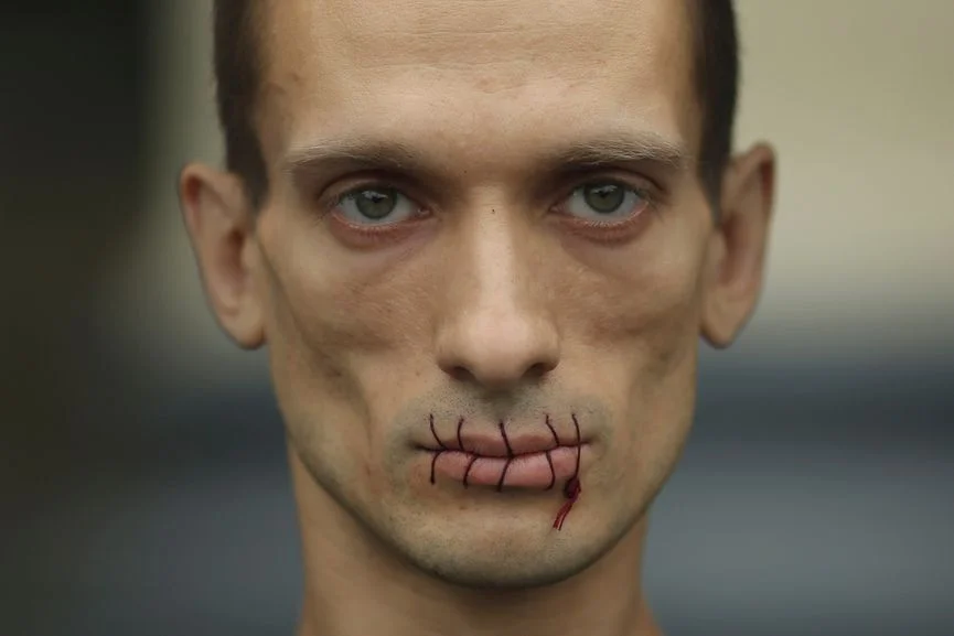 Pyotr Pavlensky. M outh sewn shut in political protest against the incarceration of Pussy Riot members. July 23, 2012.