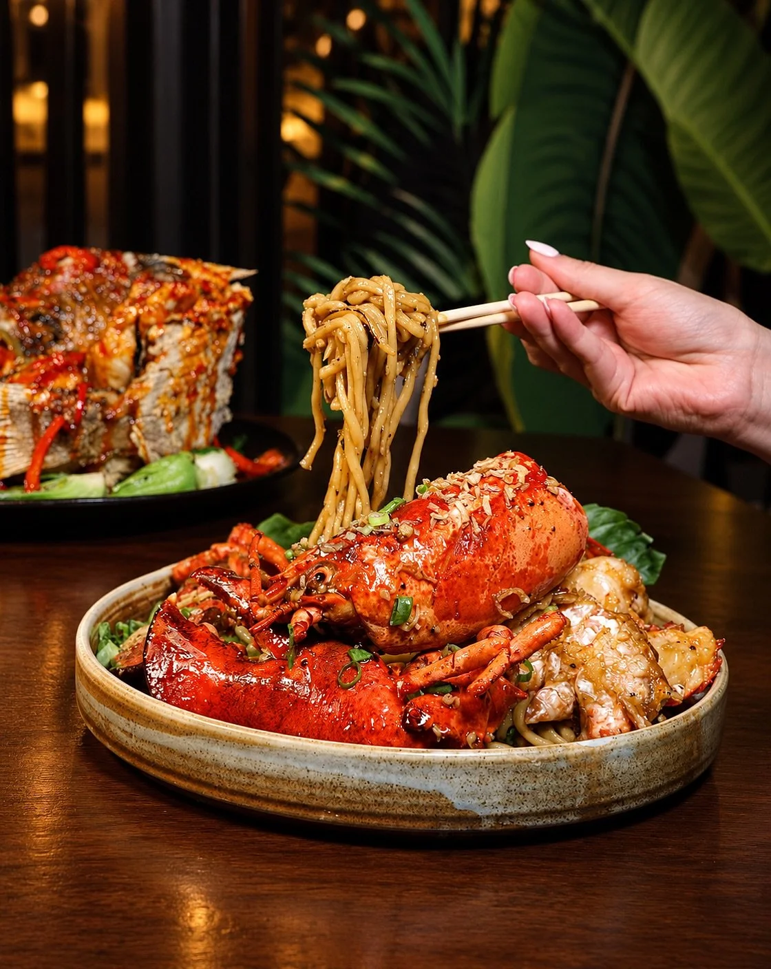 Your group chat&rsquo;s next dinner spot just dropped ✨ Experience a Singapore favorite. Live lobster tossed in a bold, aromatic black pepper sauce.