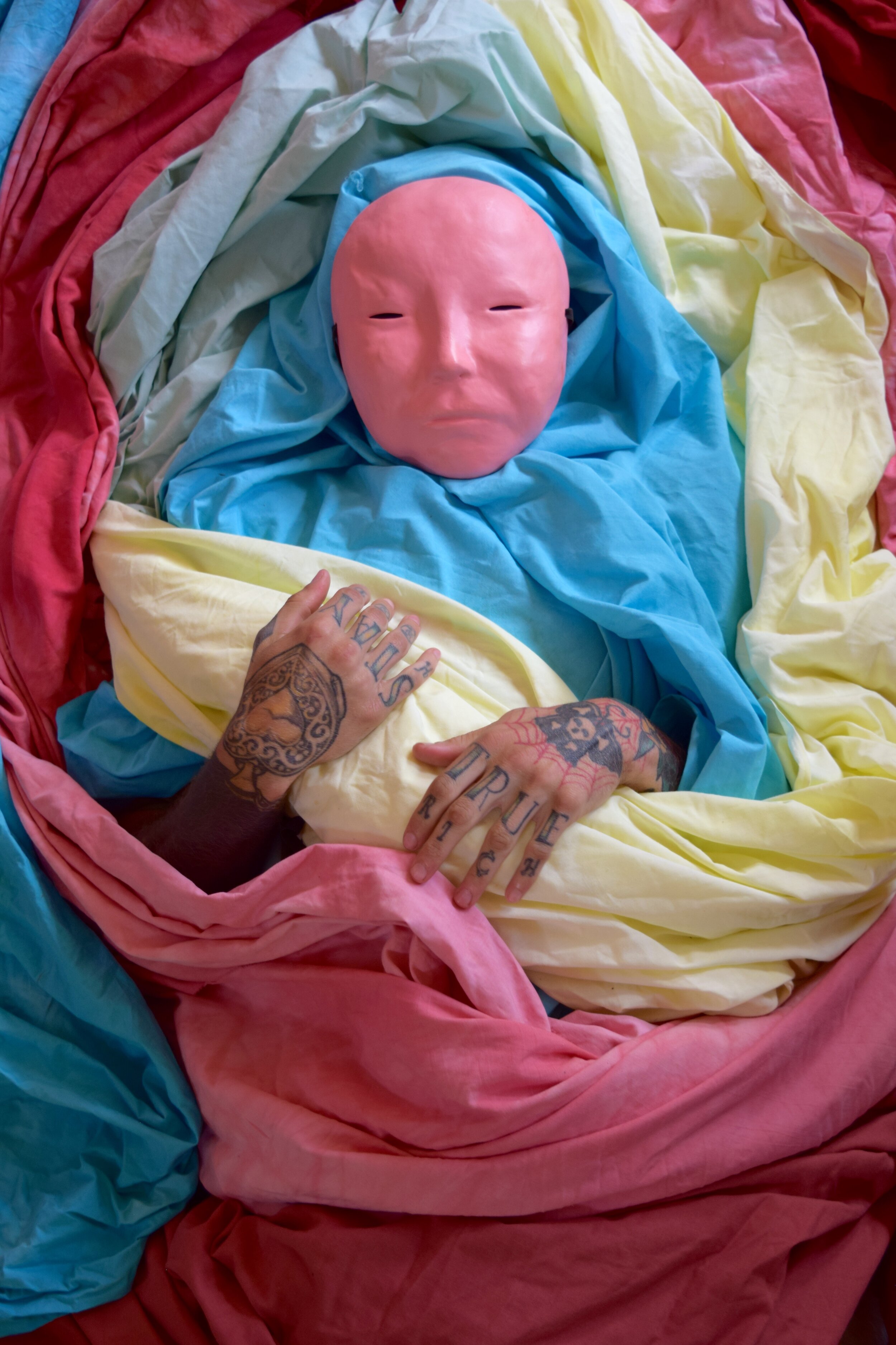  Ceramic mask, aerosol paint, dyed cotton fabric. Photo and Concept: Rachel Pozivenec. 2018 
