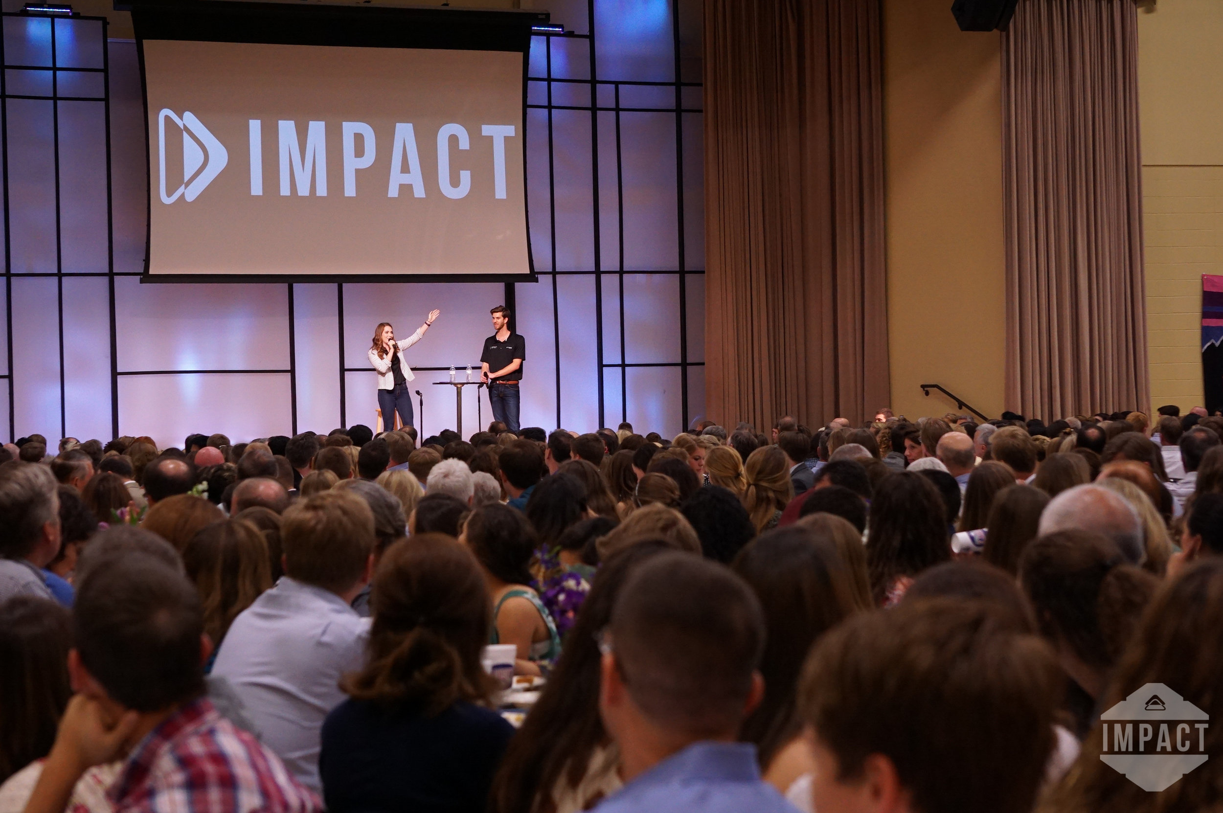 2016 Directors Alex Gersib and Megan Mulcahy welcome guests to the annual Impact Parents' Weekend Banquet.