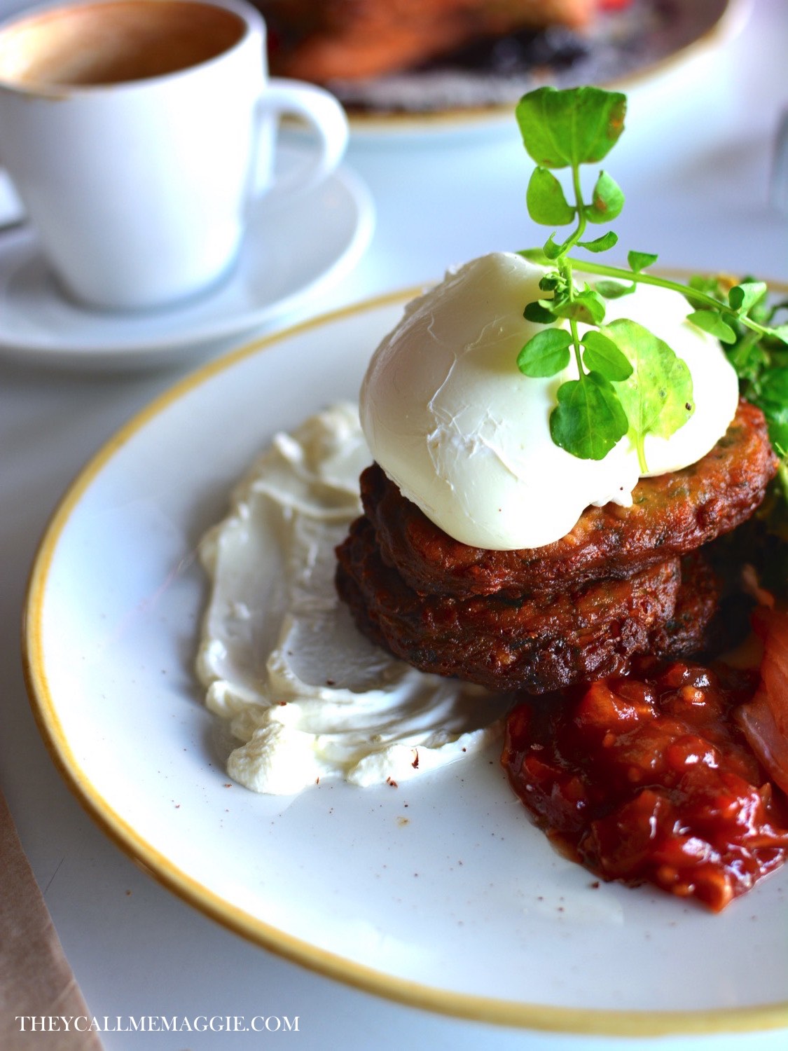 St Zita's fritters - sweet corn, zucchini and mint fritters, with creme fraiche, watercress, two poached eggs, black bean feta and avocado smash