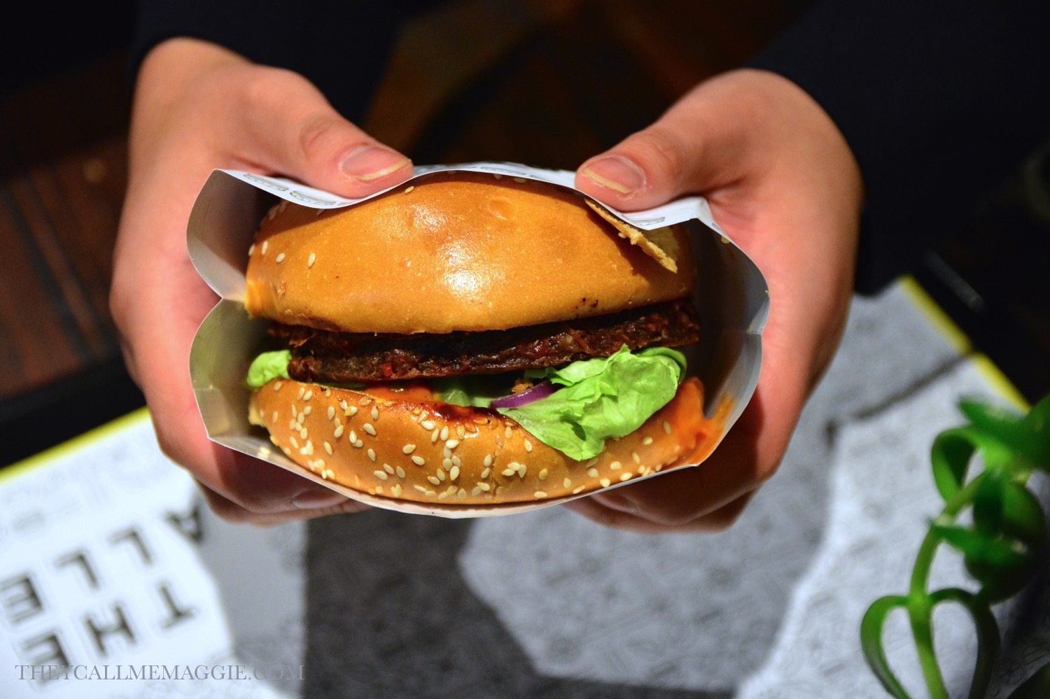 Beet steak burger - beetroot-black bean - tempeh burger with butter lettuce, tomato, onion, crispy shallots and sriracha aioli in a brioche bun. 