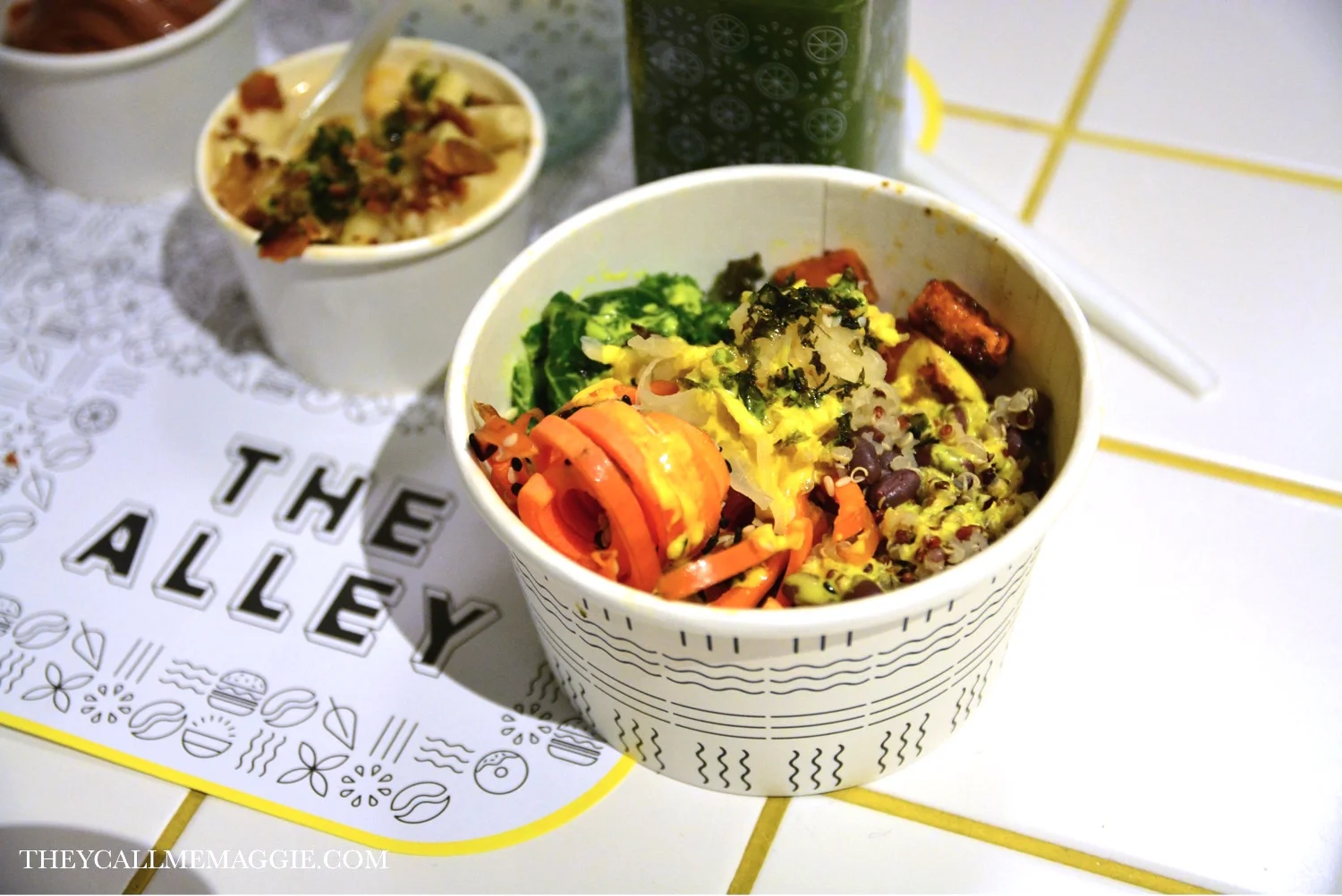 The Alley Signature Macro Bowl - quinoa medley with sauteed kale, roast sweet potato, adzuki beans, carrot ribbons, sesame seeds, crunchy nori flakes, pickled vegetables and a tumeric tahini dressing. 