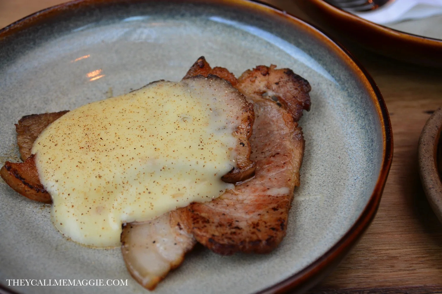 Nomada bacon with potato sauce & mushroom powder.