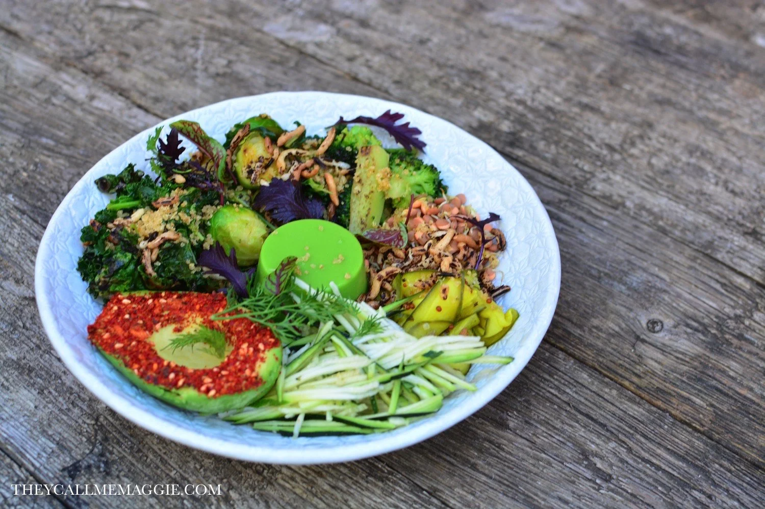 Vegan green bowl with spiced avocado, kale, puffed grains and pea panna cotta.