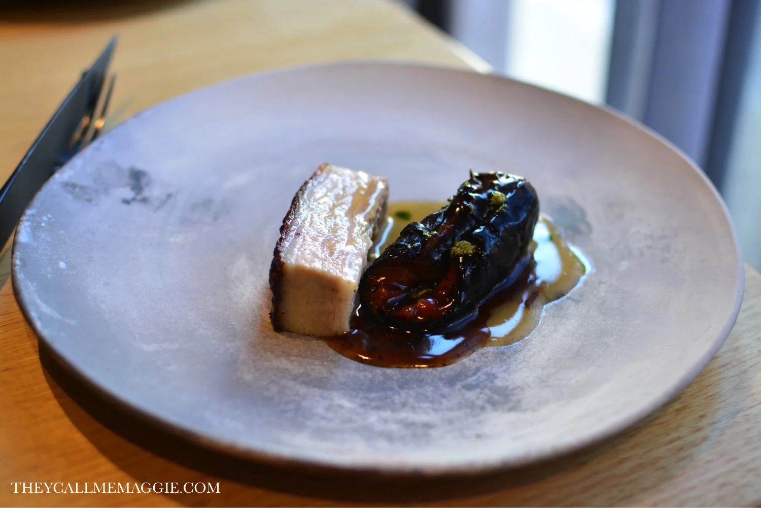 Pork belly cooked in fermented grains, blackened semi-dehydrated carrot, warmmed in carrot juice and fenugreek.