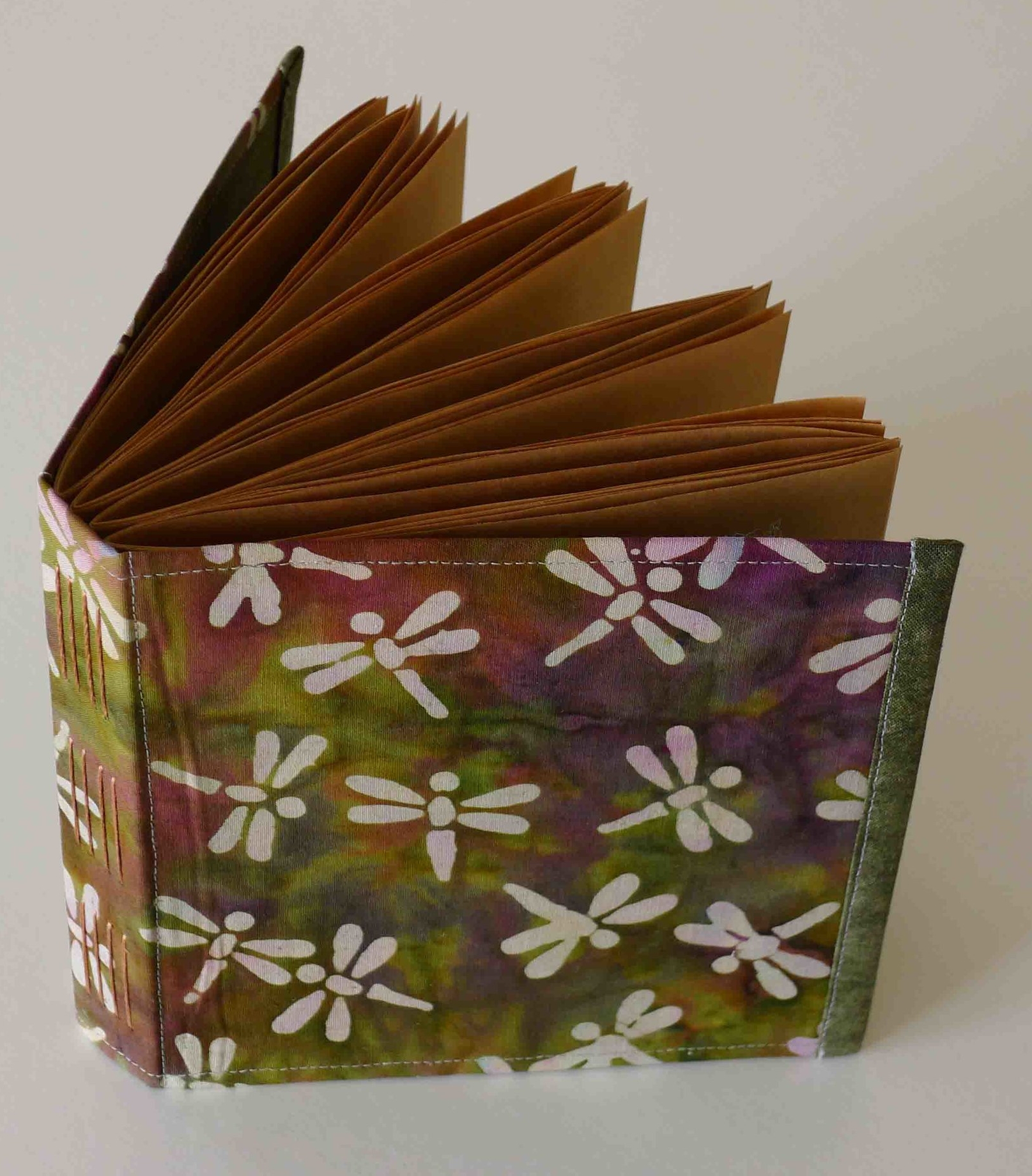 flexible fabric cover, brown paper pages