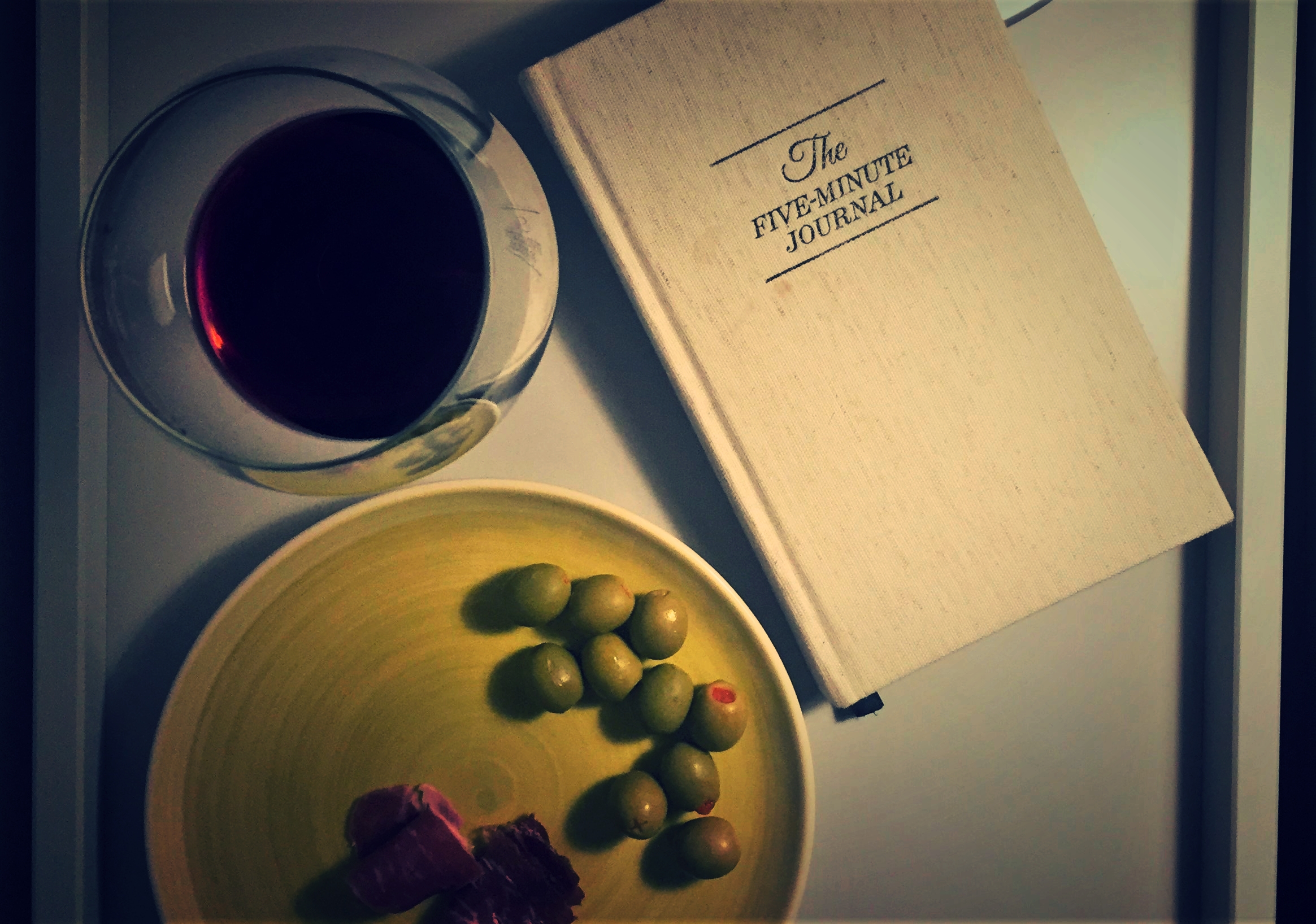 A few of my favorite things ... jamon serrano, Spanish olives, wine and, of course, my Five Minute Journal.