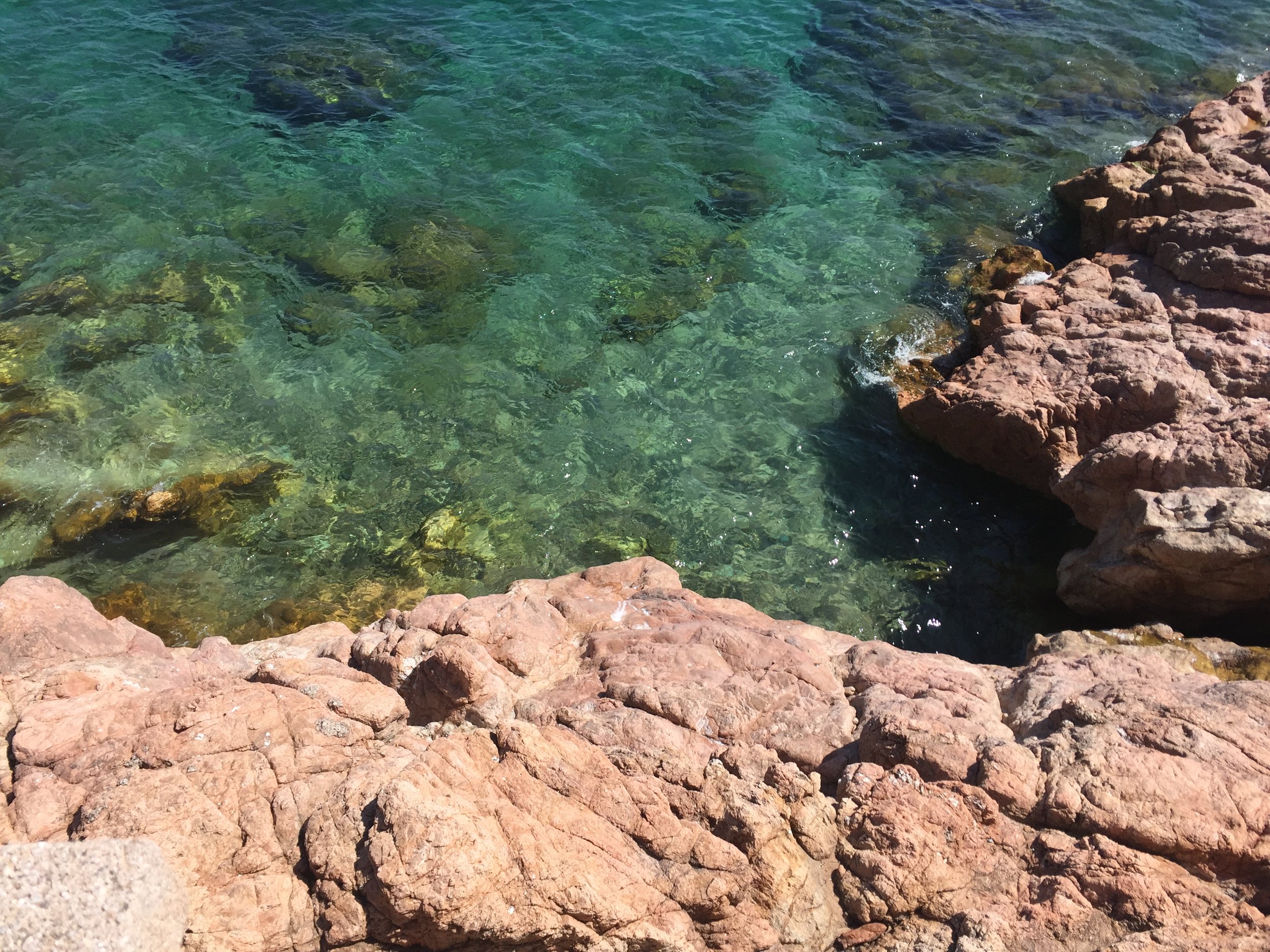 Sparkling green water in Tossa de Mar .